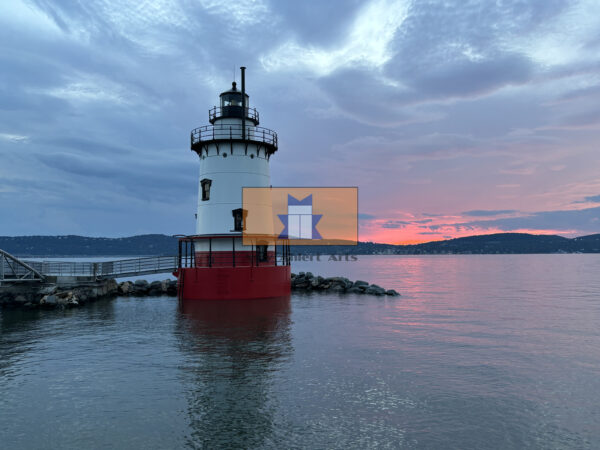 Orange and Blue sunset over Kingsland Point Lighthouse